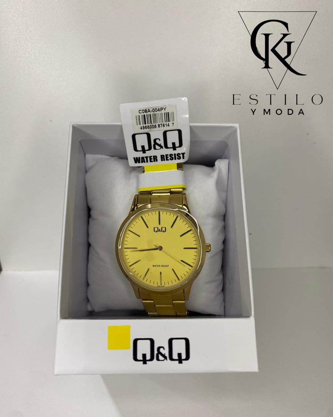 Reloj dorado Q&Q en caja